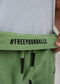 STONE GREEN TOWEL SHORTS closeup - freeyourballs stitch - men's shorts with branded waistband stitch