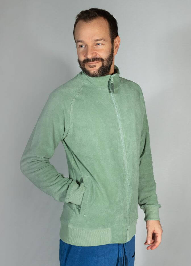 smiling man wearing nuffinz towel jacket lilypad green 
